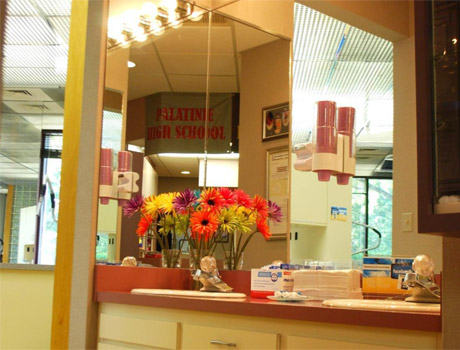 Here’s our brushing station. If you come from school or work, we have disposable toothbrushes, toothpaste, floss, and mouthwash for you to use. Dr. Razdolsky is so serious about oral hygiene that he will give you a brushing grade at each appointment. You can earn tokens and collect them to choose from a variety of rewards: water bottles, T-shirts and sweatshirts.